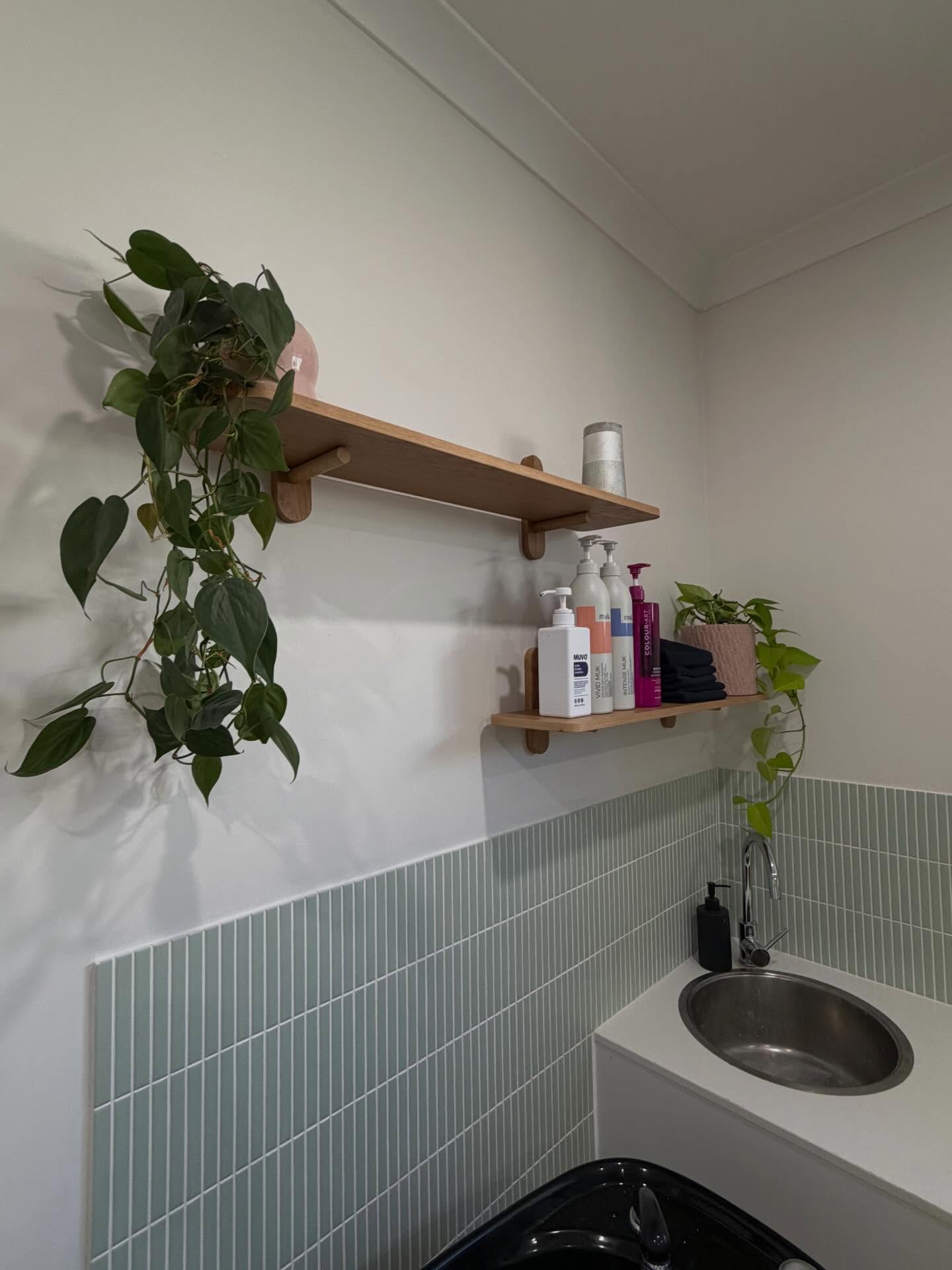 Wash basin and product shelf inside Holly's House of Hair